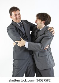 Two  Victorious Businessmen Hugging