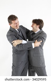 Two  Victorious Businessmen Hugging