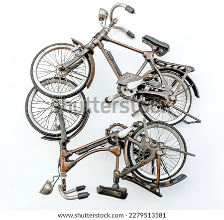 Two vintage bicycles, unique brown vintage miniature bicycles on a white isolate background