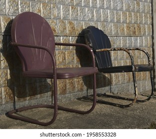 Two Vintage Metal Lawn Chairs Waiting For Someone To Sit A Spell.