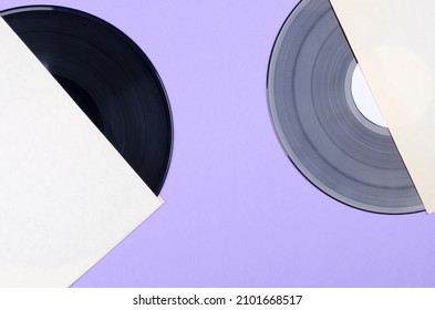 Two Vinyl Records In Package On Color Background