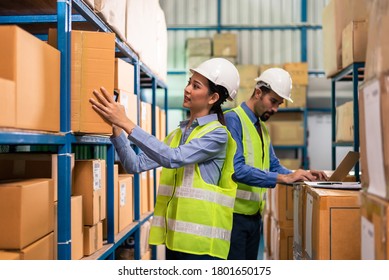 Two warehouse worker working together warehouse management - Powered by Shutterstock