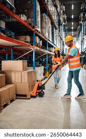 Two warehouse workers are transporting goods on a pallet truck in a large distribution center, highlighting the efficiency and organization of modern logistics operations