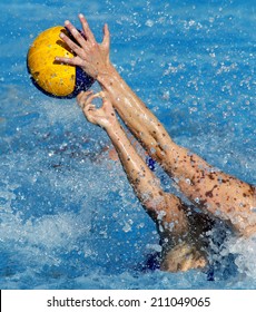 Two waterpolo players in actions during a match
