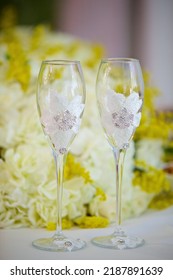 Two Wedding Glasses For Champagne Or Wine. The Concept Of Celebratory Drinks And The Wedding Table Layout.