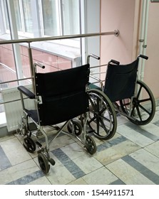 Two wheelchairs in front of the window