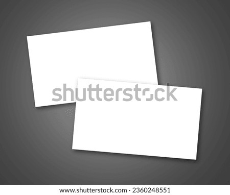 Two white cards with a few pieces of paper clipped to them