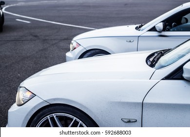 Two white cars on track 