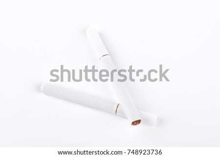 Two white cigarettes on white background. Tobacco cigarettes with filter isolated on white background.