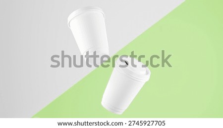 Two White coffee cups floating on diagonal Light Tea and White background. blank coffee cups mockup