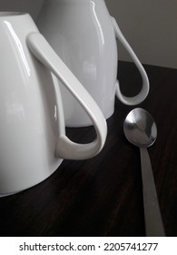 Two white cups on the table