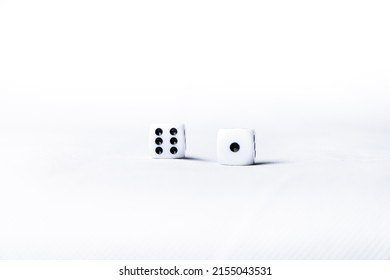 Two White Dice With Six And One Numbers Next To Each Other. Dice On White Background. Casino Game Concept. Gambling. Craps And Poker, Tabletop Or Board Games. White Cubes With Black Dots Numbers