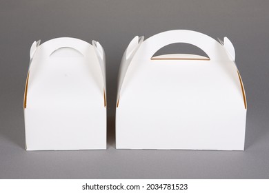 Two White Mockup Blank Paper Packaging For Bakery Large And Small Box Empty Sign With Handle In Grey Background