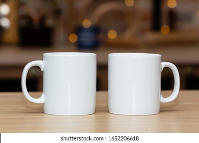 Two White Mugs For Mock-up On A Kitchen Table 