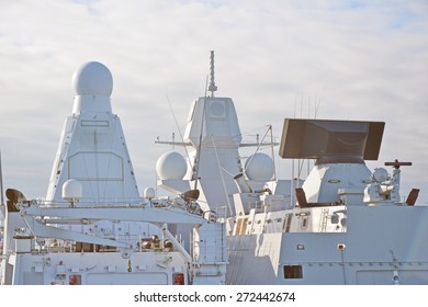 Two White Naval Ships With Radar And Other Communications.