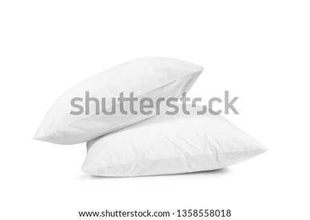 Two white pillows isolated, pillows on a white background, two pillows piled against white background