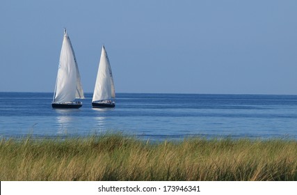 Two White Sailboats On The Sea