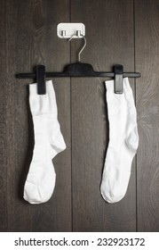 Two White Socks Hanged On The Wall