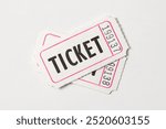 Two white vintage admission tickets isolated on white background