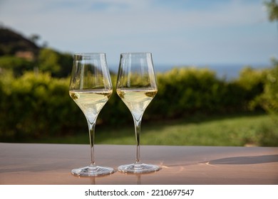 Two white wine glasses on mountain landscape background - Powered by Shutterstock