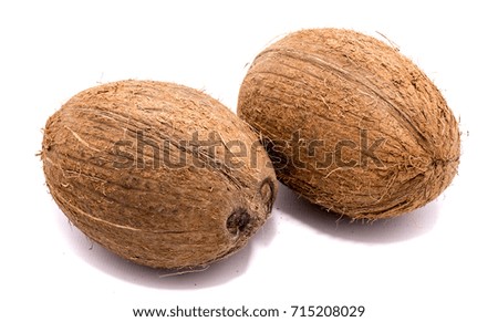 Similar – Image, Stock Photo Two whole coconuts on light background with tropical leaves and flowers, top view, frame. Copy space for your design: product or text. Vegan lifestyle concept. Coconut benefits