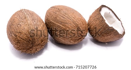 Similar – Image, Stock Photo Two whole coconuts on light background with tropical leaves and flowers, top view, frame. Copy space for your design: product or text. Vegan lifestyle concept. Coconut benefits