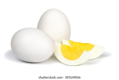 Two whole unpeeled boiled eggs and two slices of eggs isolated on a white background. - Shutterstock ID 393149056