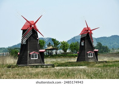 Two Windmills in a Field