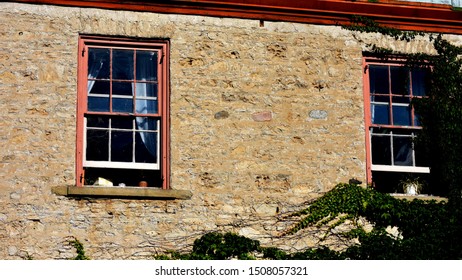 Two windows in old brick building