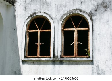 two windows on an old wall