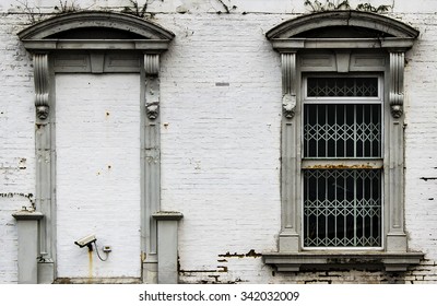 Two windows (one blind) and a CCTV camera.