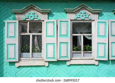 Two windows with shutters open