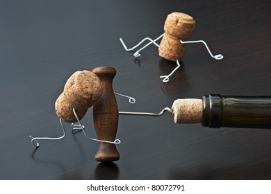 two wine corks and bottle with corkscrew