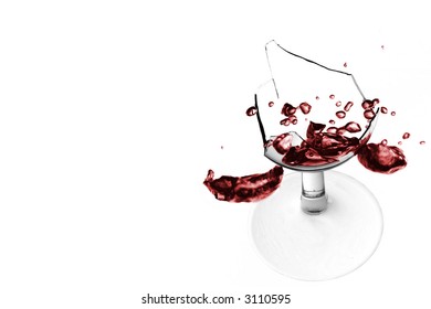 Two Wine Glasses Tipping Over And Breaking On White Background. High Key Image.