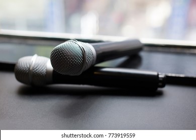 Two Wireless Microphone On The Window