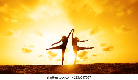  two woman doing exercise Turn to the side - Wheel on summer sunny beach. back,rear view                                 - Powered by Shutterstock