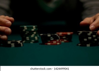 Two Woman Hands Moving Piles Of Green And Red Poker Chips On Top Of A Green Pool Table 