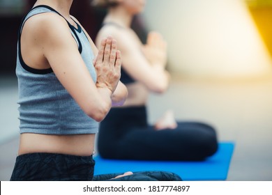 Two Woman Happy Fit Friends Exercising Outdoor In City. Yoga Relaxation Concept