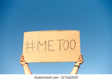 Two Woman's Hands Holding A Cardboard Sign That Says Me Too No Sexism Concept.