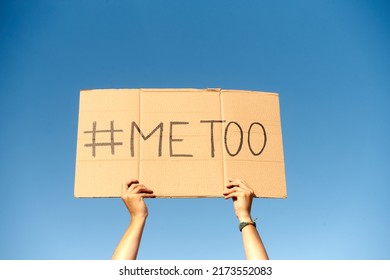 Two Woman's Hands Holding A Cardboard Sign That Says Me Too No Sexism Concept.