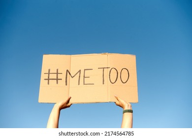 Two Woman's Hands Holding A Cardboard Sign That Says Me Too No Sexism Concept.