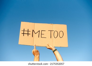 Two Woman's Hands Holding A Cardboard Sign That Says Me Too No Sexism Concept.