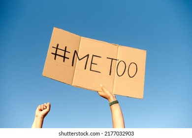 Two Woman's Hands Holding A Cardboard Sign That Says Me Too No Sexism Concept.