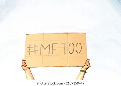 Two Woman's Hands Holding A Cardboard Sign That Says Me Too, No Sexism Concept.