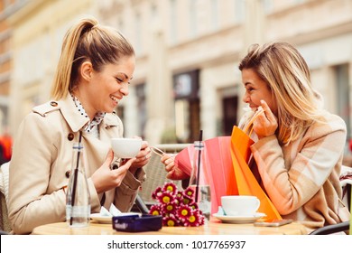 Two Women After Shopping In Cafe