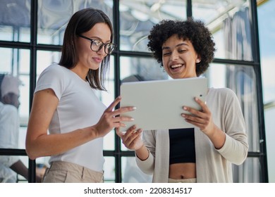 Two women analyzing documents office. Woman executives at work in office discussing some paperwork. - Shutterstock ID 2208314517
