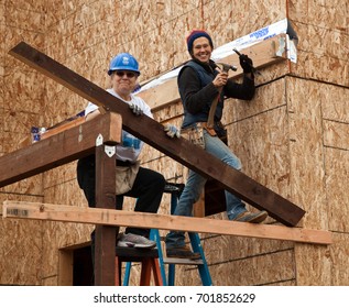 Two women build home wall for Habitat For Humanity. El Rincon, Oakland, Calif on Jan 22, 2011