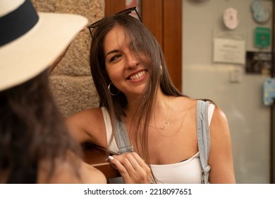 Two Women Chatting And Laughing Outside A Bar In Spain