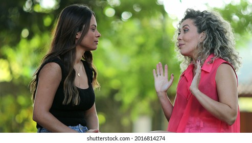 Two Women Chatting Outside, People Talking At Park