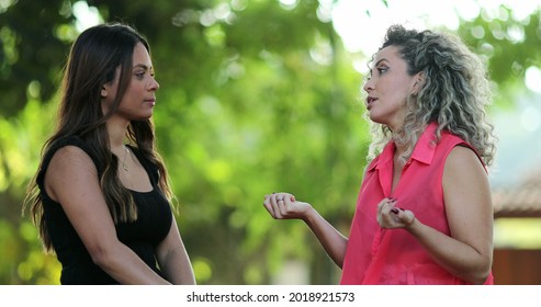 Two Women Chatting Outside, People Talking At Park